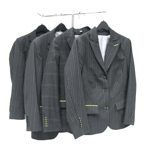 Metal rack displaying custom-tailored suits manufactured by Elasama Inc., a contract sewing company specializing in apparel production.
